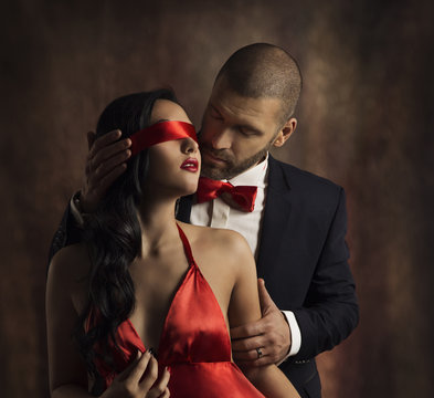 Sexy Couple Love Kiss, Man in Suit Kissing Sensual Woman, Red Fashion Blindfold on Girl Eyes