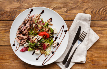 Restaurant meal, meat salad with cheese cubes