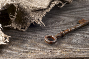 old keys over rustic wooden background.