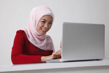 woman using computer smiling