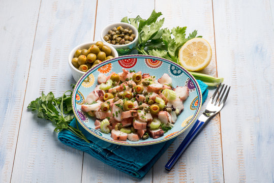 octopus salad with capers celery and green olives and lettuce