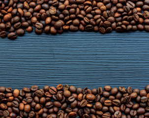 Coffee beans on dark wood background