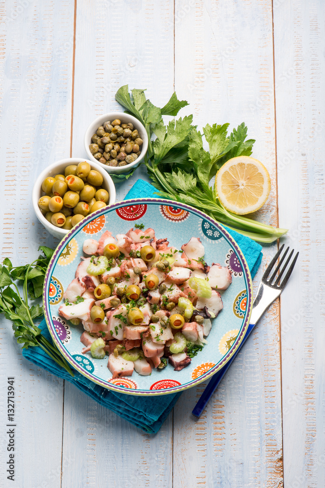 Wall mural octopus salad with capers celery and green olives and lettuce