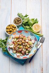 octopus salad with capers celery and green olives and lettuce