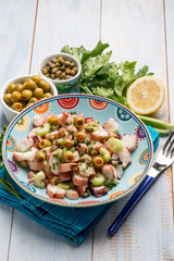 octopus salad with capers celery and green olives and lettuce