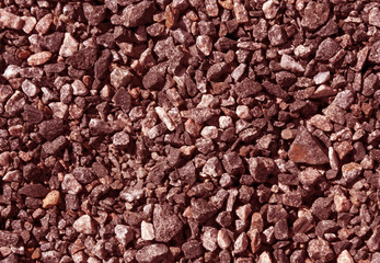 Pile of red toned gravel stones.
