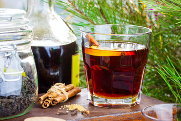 Hot grog with tea, cinnamon and lemon, horizontal