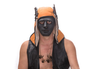 portrait of a man in terrible mask, a man with a knife, a murderer, a wild hunter, vintage