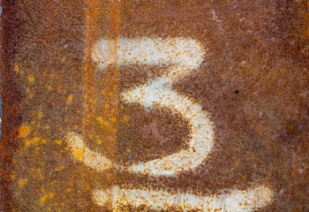 Number 3, on rust with metal surface