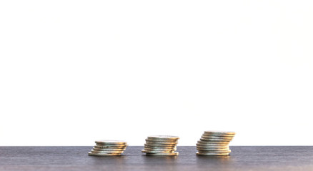 Medal tiles for a bar graph. The volume increase on black wooden