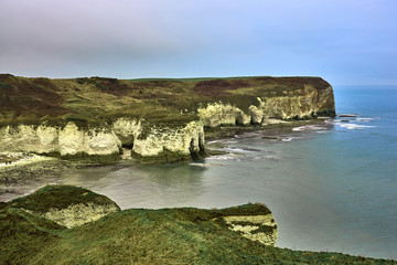 A view of the beach and surrounding rock at the North Landing at Flamborough Head on the north Yorkshire coast