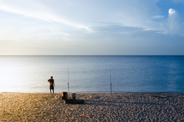 Man fishing on beach