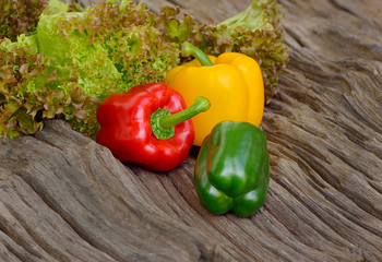 Fresh green lettuce leaves and Red ,Green , yellow bell pepper o