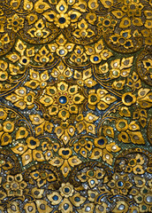 mosaic Buddhist temple in gold tones