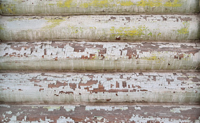 the surface of the old wooden logs with peeling paint background