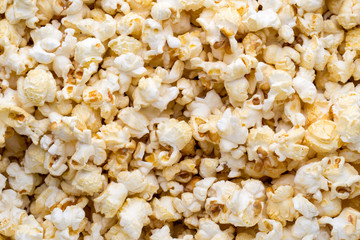 Popcorn background. Caramel sweet corn. Cinema snack.