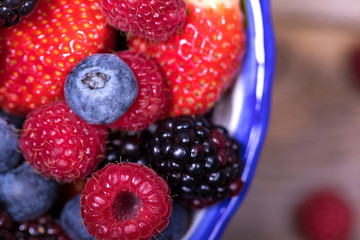 Overhead view of summer fruits in a bowl