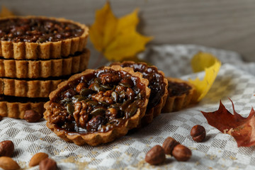 Autumn delicious cakes with nuts on plate.