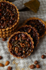 Autumn delicious cakes with nuts on plate.