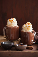 hot chocolate with whipped cream caramel in mason jar