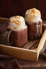 hot chocolate with whipped cream caramel in mason jar