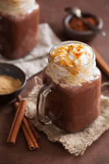 hot chocolate with whipped cream caramel in mason jar