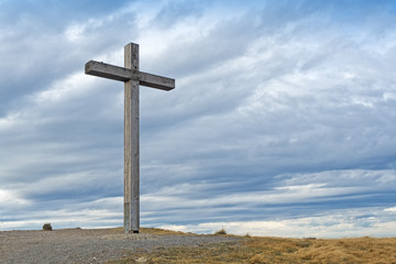 Wooden cross on mountain peak
