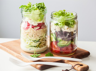 healthy vegetable cheese salad in mason jars