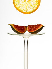Two figs on a reversed glass