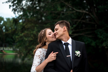 happy bride and groom at a park on their wedding day