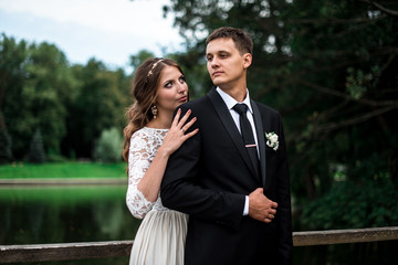 happy bride and groom at a park on their wedding day