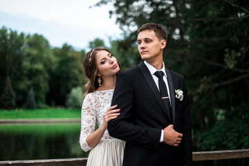 happy bride and groom at a park on their wedding day