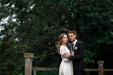 happy bride and groom at a park on their wedding day