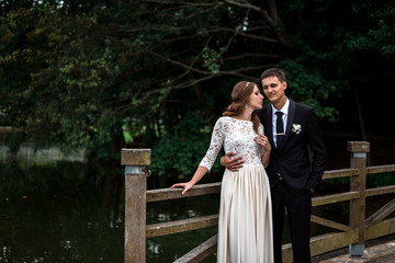 happy bride and groom at a park on their wedding day