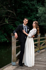 Fototapeta premium happy bride and groom at a park on their wedding day