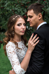 Fototapeta premium happy bride and groom at a park on their wedding day