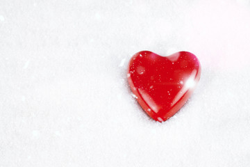 Shape of red heart in snow white background