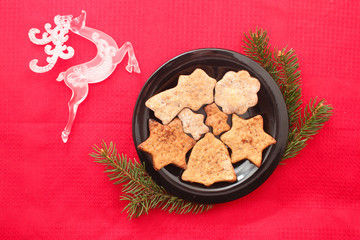 Christmas cookies and decorations on red background