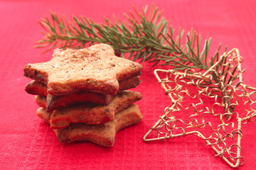 Christmas cookies and decorations on red background