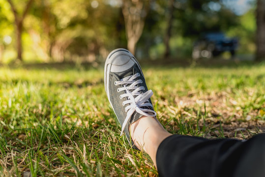 The black shoe on the yrd with sunlight in natural.