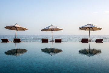Beach umbrellas on an infinity pool