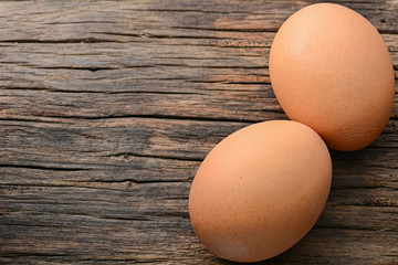 Fresh chicken egg on wooden table