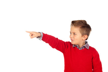 Blond child with red jersey pointing with his finger