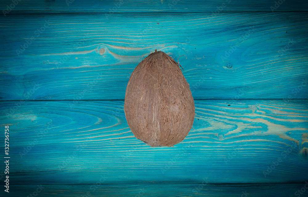 Wall mural coconut on the blue wood background