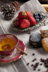 Mix flavour of scone biscuit decorate with chocolate ship and fresh strawberry and blueberry
