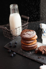 Chocolate ship soft cookies pile up decorate with chocolate ship and milk in a bottle.