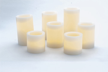 Relaxing aromatic candles for spa on white background