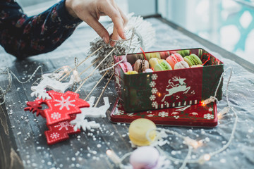 Christmas background with macaroons garlands and snow