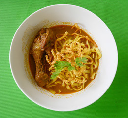 Curried Noodle Soup (Khao soi) with chicken , Traditional of Northern Thai food.