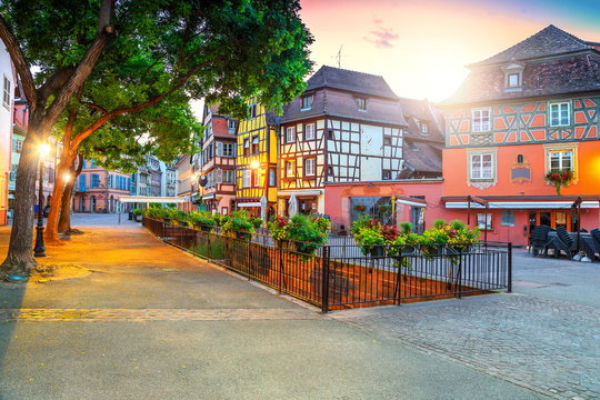Colorful medieval half-timbered facades with decorated street, Colmar, France